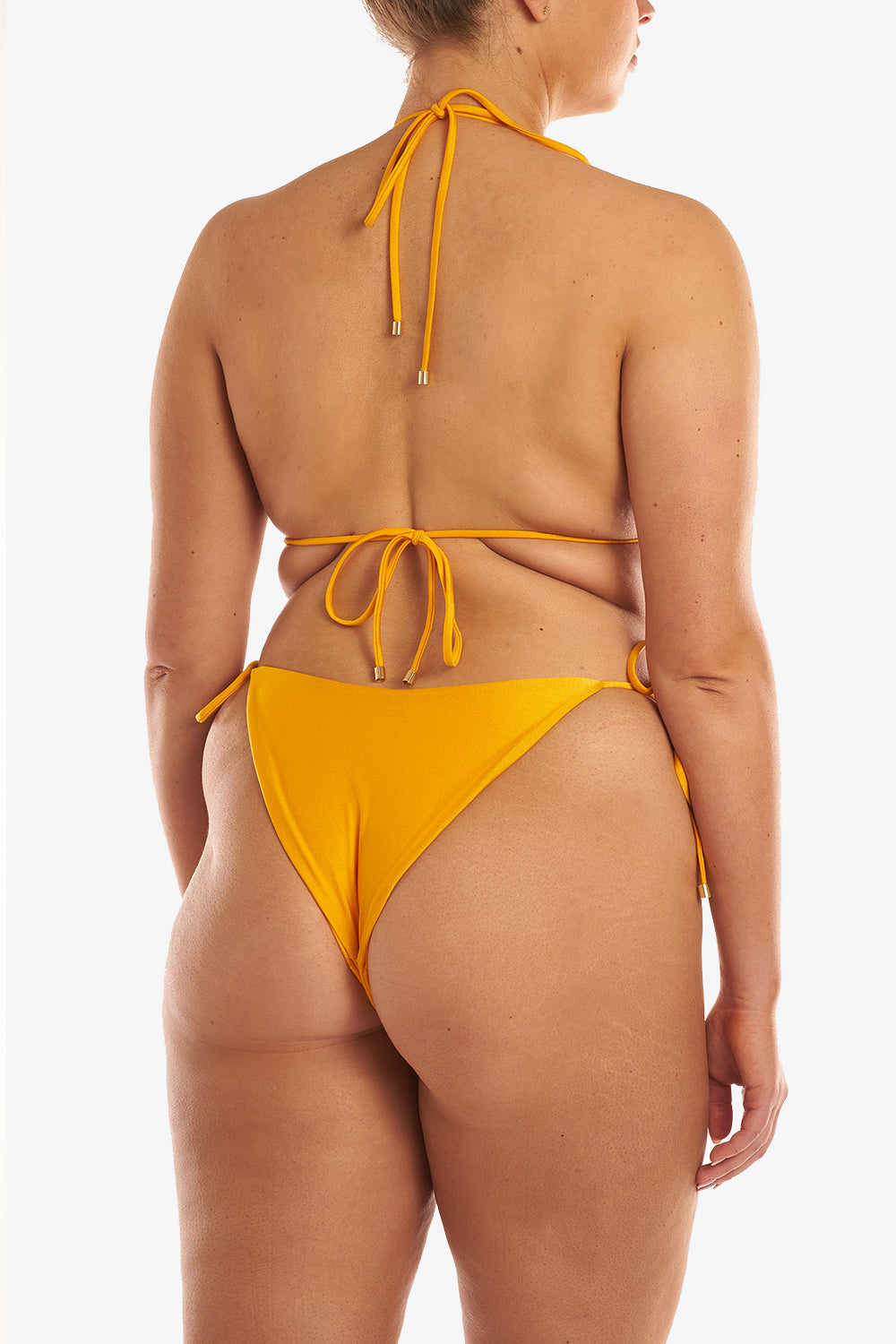 Dioni bottom - elixia. A bottom with golden details and medium coverage.